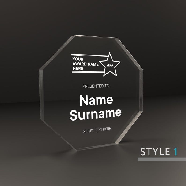 May include: A clear octagon-shaped acrylic award plaque with a star design and the text "Your Award Name Here" and "Year". The plaque also includes the text "Presented to Name Surname" and "Short Text Here".