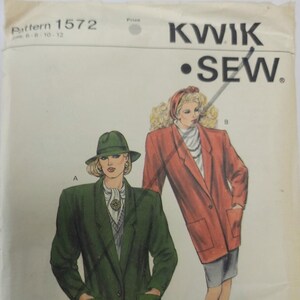 May include: Vintage Kwik Sew sewing pattern 1572 showing illustrations of two women in blazers. One wears a green blazer and hat, the other a red blazer. The pattern includes sizes 8-12.