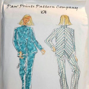 May include: A sewing pattern envelope titled Paw Prints Pattern Company 1011 Samurai Shirt & Trousers. The illustration shows a front view of a teal patterned shirt and trousers, and a back view of a striped shirt and trousers with red dots.