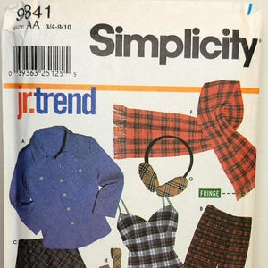 May include: Simplicity Jr. Trend sewing pattern featuring various plaid clothing items. Includes a blue button-up shirt, skirt, pants, camisole, scarf, and ear muffs. The pattern size is AA 3/4-9/10.