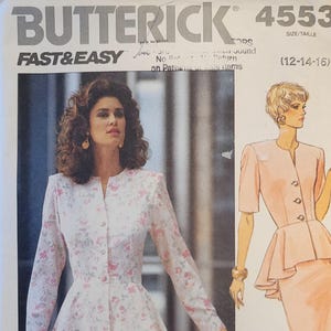 May include: Butterick sewing pattern 4553, showing a floral suit with a peplum jacket and pencil skirt, and a second design of a plain suit with a peplum jacket and pencil skirt. The text reads "FAST & EASY".