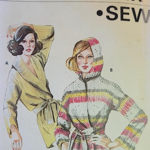May include: Vintage Kwik Sew pattern 619 showing illustrations of two belted jackets. One is plain yellow, the other is striped with pink, yellow, and grey. The pattern includes sizes S, M, L, and XL.
