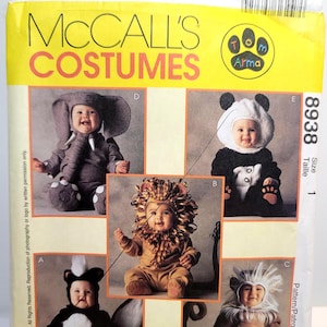 May include: A McCall's Costumes sewing pattern envelope 8938 featuring Tom Arma designs. The yellow and white packaging displays five infant costumes: an elephant, a panda, a lion, a skunk, and a monkey, each worn by a baby in a studio setting.