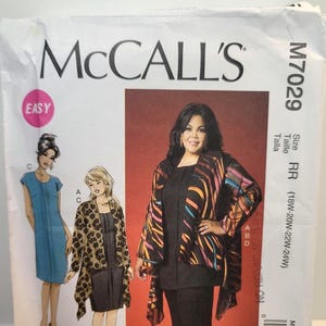 May include: A McCall's M7029 sewing pattern envelope featuring illustrations and a photograph of a three-piece outfit consisting of a solid black top, solid black pants, and a long-sleeved, open-front jacket with a colorful, abstract striped pattern.
