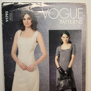 May include: Vogue Patterns V1793 sewing pattern envelope featuring two dress designs. One is a sleeveless cream dress with vertical stripes, and the other is a short-sleeved grey dress with vertical stripes. The text V1793 and Vogue Patterns is visible.