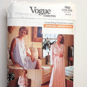 May include: Vogue Patterns sewing pattern 7653 for XS-S-M sizes. The pattern features images of women in nightgowns and a robe. The sewing rating is average. The pattern includes the text "Vogue Patterns" and "7653".