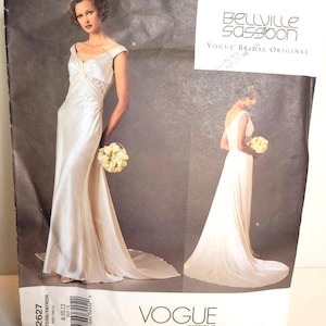 May include: A Bellville Sassoon Vogue Bridal Original sewing pattern envelope for a floor-length white gown. The front shows the dress from the front and back, featuring a V-neckline, cap sleeves, and a lace inset at the waist. Pattern number 2627.