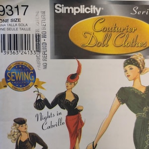 May include: Simplicity Couturier Doll Clothes sewing pattern. The pattern features illustrations of doll clothing designs. The cover includes the text "Nights in Cabrillo" and "One Size". The pattern also has an award seal for sewing excellence.