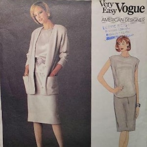 May include: A Very Easy Vogue American Designer sewing pattern 1147 by Anne Klein. The envelope features a photograph and illustration of a light-colored two-piece outfit consisting of a sleeveless top and a knee-length skirt with a matching jacket.