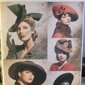 May include: Vogue Accessories pattern 7464 showcases five vintage hat designs. The hats include a large green hat, a red hat with floral accents, a patterned turban-style hat, a wide-brimmed black hat, and a black hat with a beaded brim.