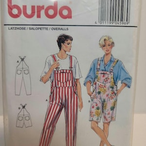 May include: A sewing pattern package featuring overalls. The package has the brand name "burda" in red. The illustrations show two styles: striped overalls and floral print shorts overalls. The text "LATZHOSE / SALOPETTE / OVERALLS" is visible.