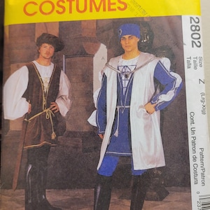 May include: McCall's Costumes pattern showing two medieval outfits. One has a brown vest and black boots, the other a blue tunic and white overcoat. The pattern number is 2802.