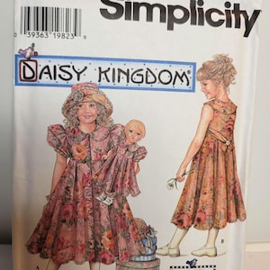 May include: Simplicity sewing pattern 7550 for Daisy Kingdom, size NN 8, 10, 12, 14. The envelope features illustrations of two children wearing floral dresses with matching hats, one holding a doll in a matching dress. Includes a bonus doll dress pattern.