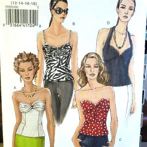May include: Vogue sewing pattern V8393, size DD (12-14-16-18), featuring illustrations of four different tops. Designs include a white strapless top, a zebra print camisole, a red polka dot strapless top with a bow, and a black halter top.