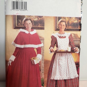May include: Butterick sewing pattern 6816 for sizes 18-20-22. The envelope features two garment options: a red floor-length dress with a white faux fur trimmed cape and cuffs, and a red plaid dress with a white polka dot apron and ruffled collar.