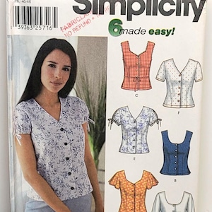 May include: Simplicity sewing pattern 7167 for sizes PP 12, 14, 16, 18. The envelope features illustrations of six different blouse variations with various sleeve lengths, necklines, and button-front closures, including floral, gingham, and solid fabric designs.