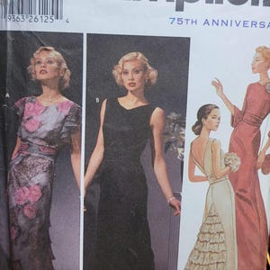 May include: Simplicity sewing pattern featuring illustrations of elegant evening gowns. The designs include a black sleeveless dress, a gown with pink floral accents, and a cream-colored dress with a ruffled train. The pattern celebrates the 75th anniversary.
