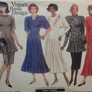May include: A Vogue's Basic Design sewing pattern envelope featuring five illustrations of dresses with varied sleeve lengths, necklines, and skirt silhouettes. The text includes Vogue's Basic Design, Sewing Rating, and EASY/FACILE.