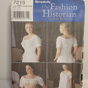 May include: Simplicity sewing pattern 7215 The Fashion Historian by Martha McCain, size RR 14, 16, 18, 20. The envelope features illustrations of a white off-the-shoulder blouse, a white corset, a beige corset, and a white dress with short puff sleeves.