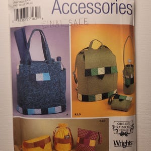 May include: A Simplicity 5320 sewing pattern envelope for accessories featuring illustrations of a blue tote bag, a green backpack, a bottle holder, a small pouch, a yellow drawstring bag, and a red plaid bag with the text Shirley Botsford Designs.