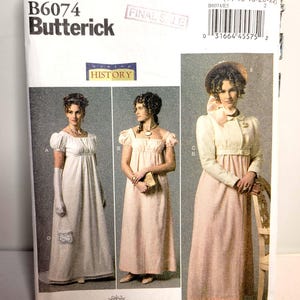 May include: Butterick sewing pattern B6074 for historical dresses in sizes 14-16-18-20-22. The package features illustrations of three floor-length gowns with empire waists, short puff sleeves, and a long-sleeved jacket option with a bonnet.