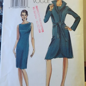 May include: A Very Easy Vogue sewing pattern, V8110, with illustrations of two women's dresses. The pattern includes sizes 14-16-18-20. The cover displays the text "Very Easy Vogue" and "Fabricland Distributors".