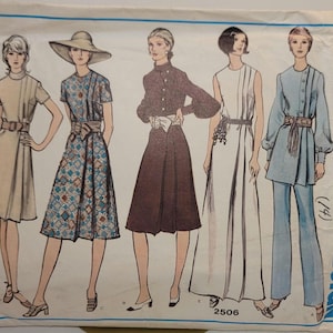 May include: A Vogue's Basic Design sewing pattern envelope, number 2506, featuring illustrations of five different outfits including dresses, a skirt, and a pantsuit with various necklines, sleeve lengths, belts, and patterns in blue, brown, and white.