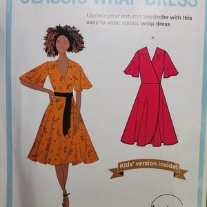 May include: A sewing pattern for a classic wrap dress. The image shows a drawing of a woman wearing an orange wrap dress with a black belt. A red wrap dress illustration is also shown. Text includes "CLASSIC WRAP DRESS" and "Girls' sizes 3-8 Women's sizes S-XL."