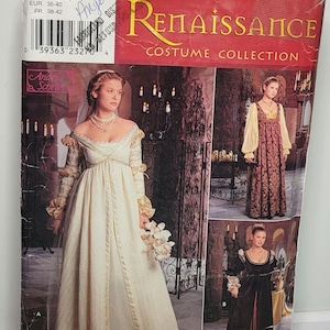 Puede incluir: Un sobre de patrón de costura Simplicity Renaissance Costume Collection, número 0657, talla N 10, 12, 14. El frente muestra tres variaciones de vestidos de manga larga, talle imperio y escote cuadrado, en telas de color crema, rojo estampado y negro.