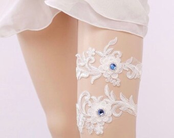 Gorgeous lace blue rhinestone bridal garter set