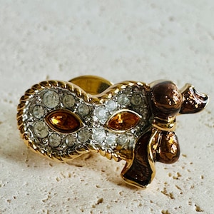 Signed Swarovski Carnival Mask Pin with Orange Crystal Eyes and Orange Bow