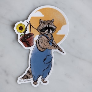 Raccoon flower gardener vinyl sticker