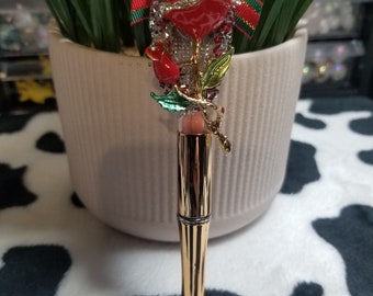 Refillable beaded pen