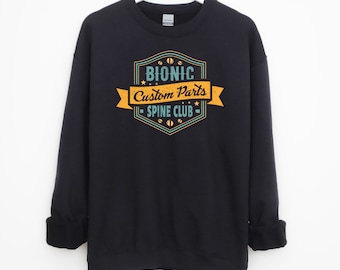 May include: Black sweatshirt with a vintage-style logo that says "Bionic Custom Parts - Spine Club".