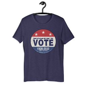 May include: A navy blue t-shirt with a red, white, and blue circular graphic that says "Women's Vote 1920-2020 100 Years 19th Amendment".