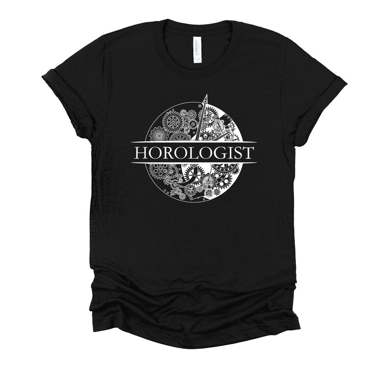 May include: Black t-shirt with a white graphic of a clock face made of gears and the word "HOROLOGIST" printed below.