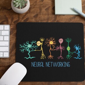 May include: Black mouse pad with a colorful illustration of neurons connected together. The text "Neural Networking" is printed below the illustration.