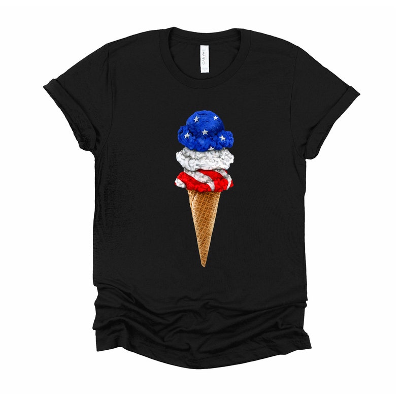May include: A black t-shirt with a graphic of a three-scoop ice cream cone. The ice cream is red, white, and blue, resembling the American flag.