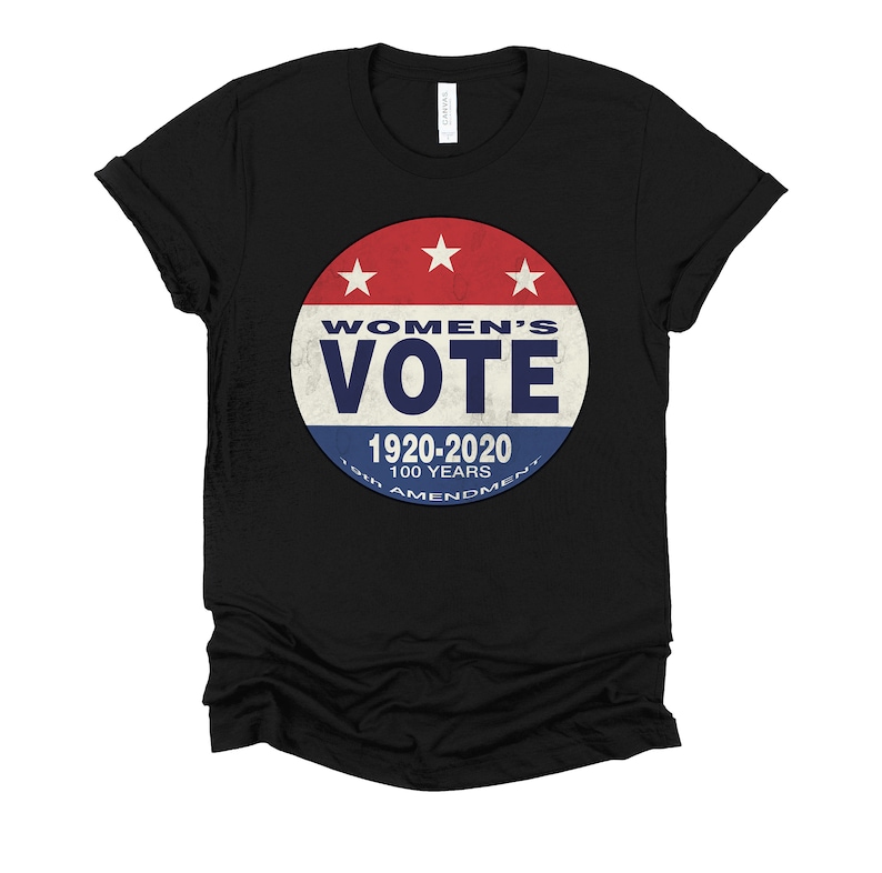 May include: Black t-shirt with a red, white, and blue button featuring the text "Women's Vote" and "1920-2020 100 Years 19th Amendment".