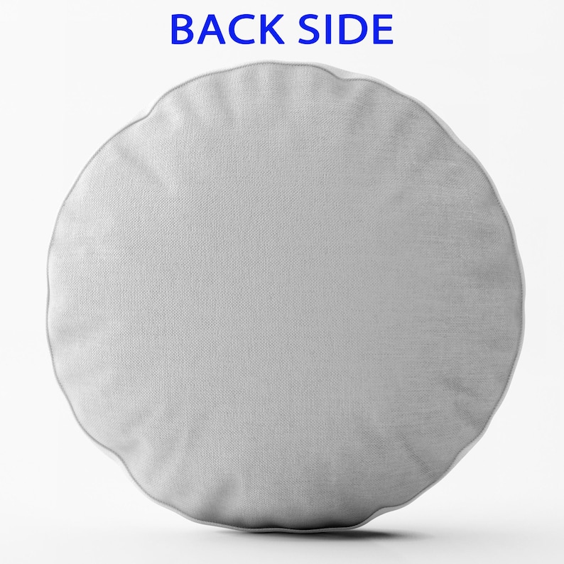 May include: A plain white round cushion with a smooth, textured fabric surface. The cushion is shown against a white background.
