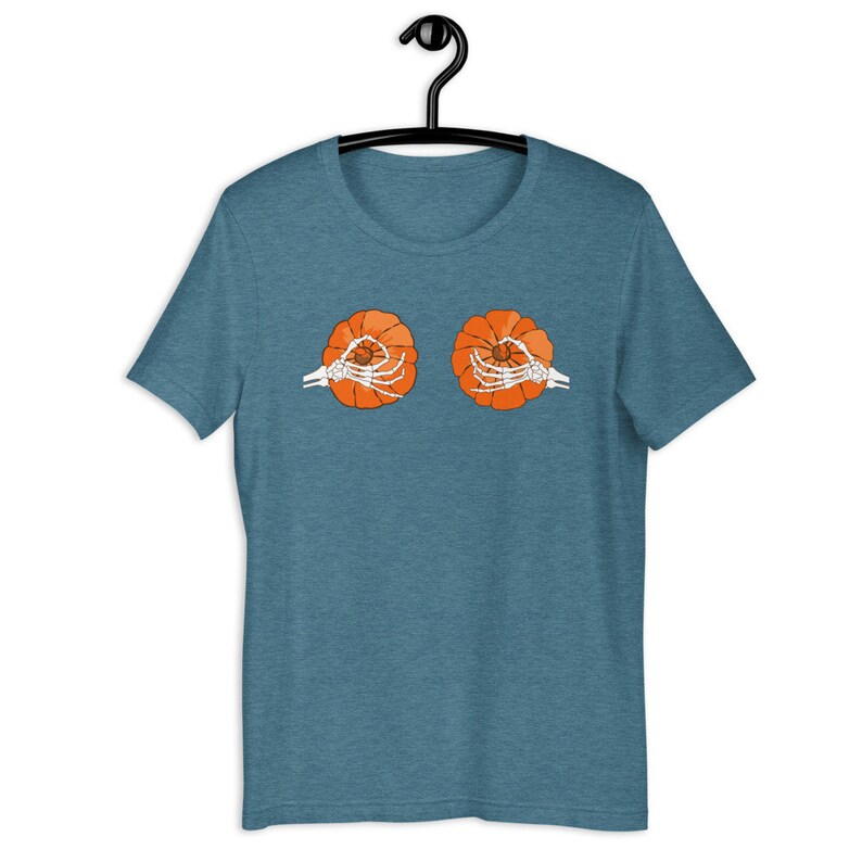 May include: A teal blue t-shirt with a graphic of two orange pumpkins held by skeleton hands.