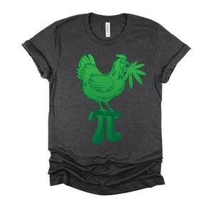 May include: A dark heather grey t-shirt with a green graphic of a chicken holding a marijuana leaf standing on a green pi symbol.