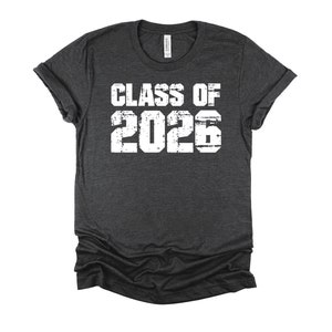 May include: Dark gray t-shirt with white text that reads "Class of 2026".