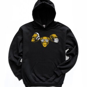 May include: Black hooded sweatshirt with a graphic of three monkey faces. The middle monkey is wearing sunglasses, the monkey on the left is wearing headphones, and the monkey on the right is wearing a face mask.