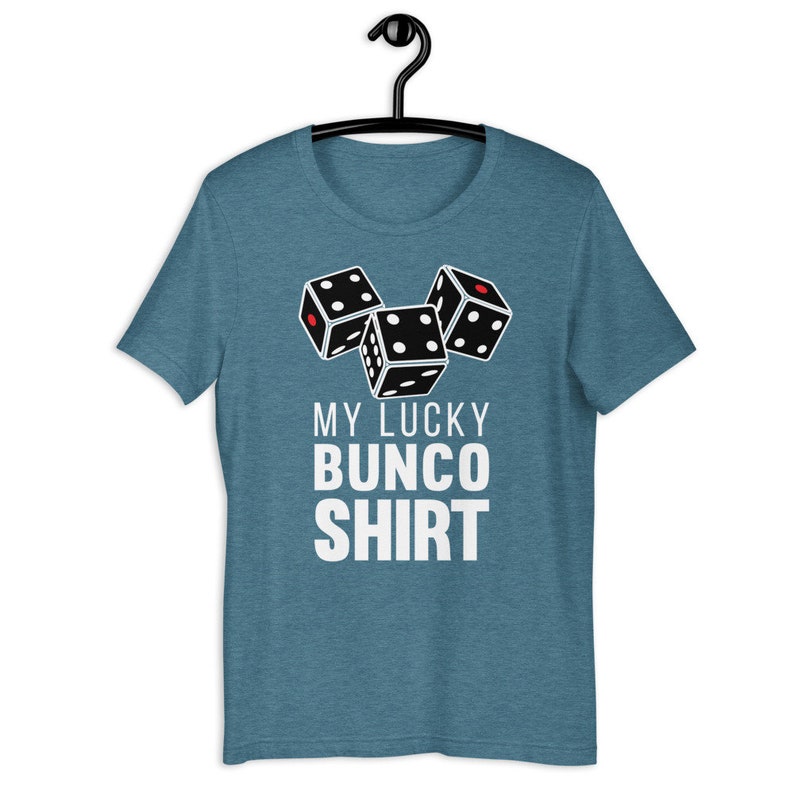 May include: A teal blue t-shirt with a white graphic of three dice and the text "My Lucky Bunco Shirt".