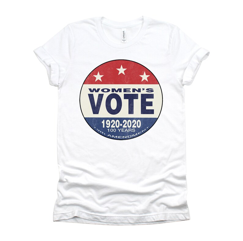 May include: White t-shirt with a red, white, and blue circular graphic that says "Women's Vote 1920-2020 100 Years 19th Amendment."