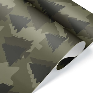 May include: A roll of camouflage-patterned paper with a repeating design of stylized, dark green tree shapes on a lighter green background. The paper is partially unrolled, revealing a white underside.