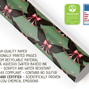 May include: Decorative wrapping paper featuring a repeating pattern of black moth illustrations with pink bows on a green background. The paper is thick, high-quality, and made from recyclable material. The paper is durable and scratch-resistant.