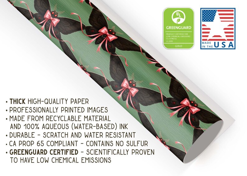 May include: Decorative wrapping paper featuring a repeating pattern of black moth illustrations with pink bows on a green background. The paper is thick, high-quality, and made from recyclable material. The paper is durable and scratch-resistant.