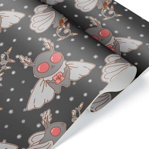 May include: Wrapping paper with a repeating pattern of cartoon moth-like creatures with antlers, wings, and gifts. The moths are gray with pink eyes and accents, set against a dark gray background with white snowflakes.